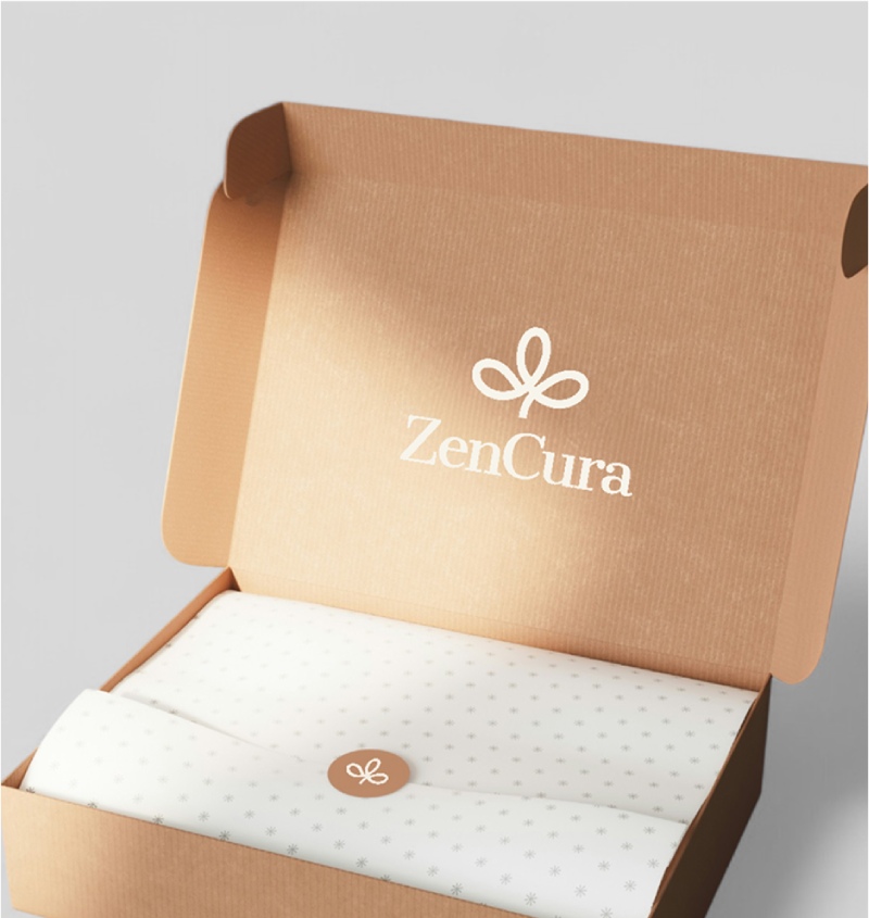 Open brown cardboard box with "ZenCura" logo on the inside lid; white tissue paper with a matching sticker neatly covers the contents.